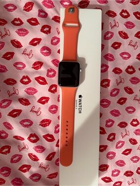 Apple Watch with Coral-Orange Sport Band